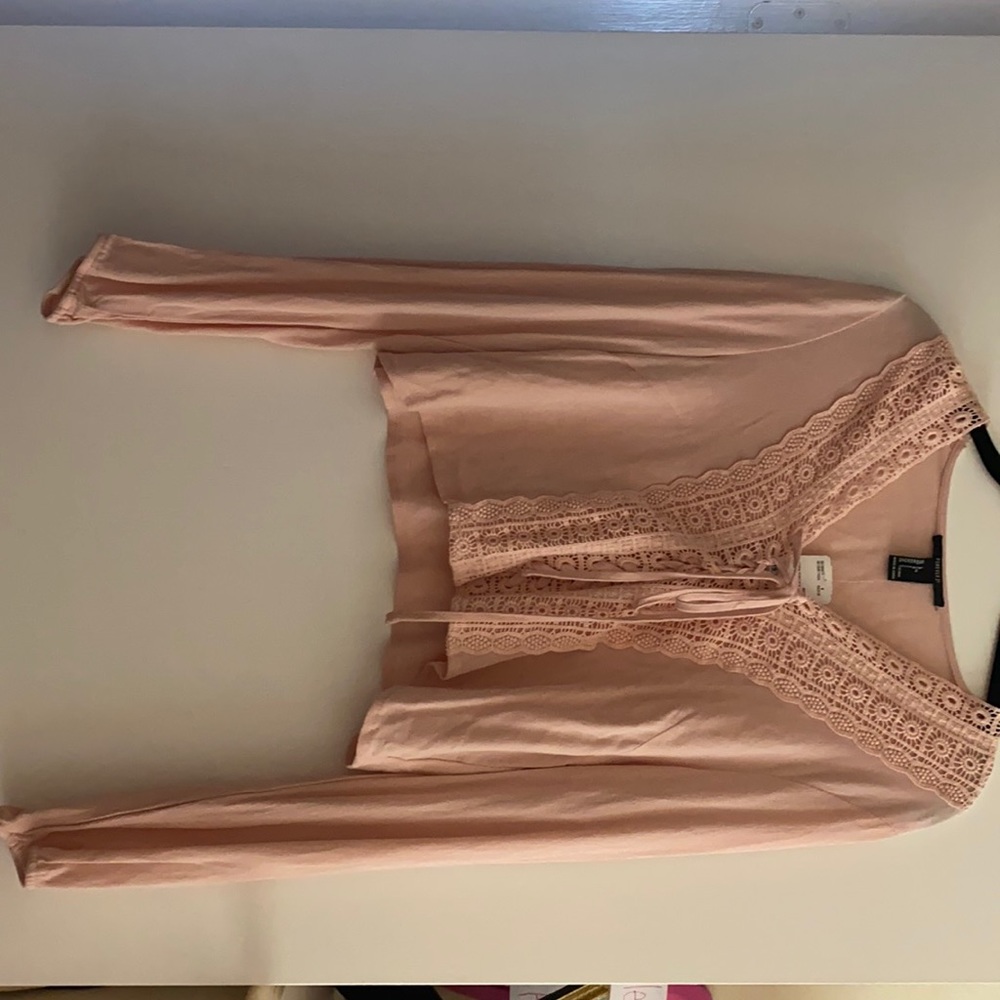 Brand new. Long sleeve top.